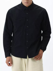 Black cotton buttoned long sleeve shirt with diagonal seam detail on chest