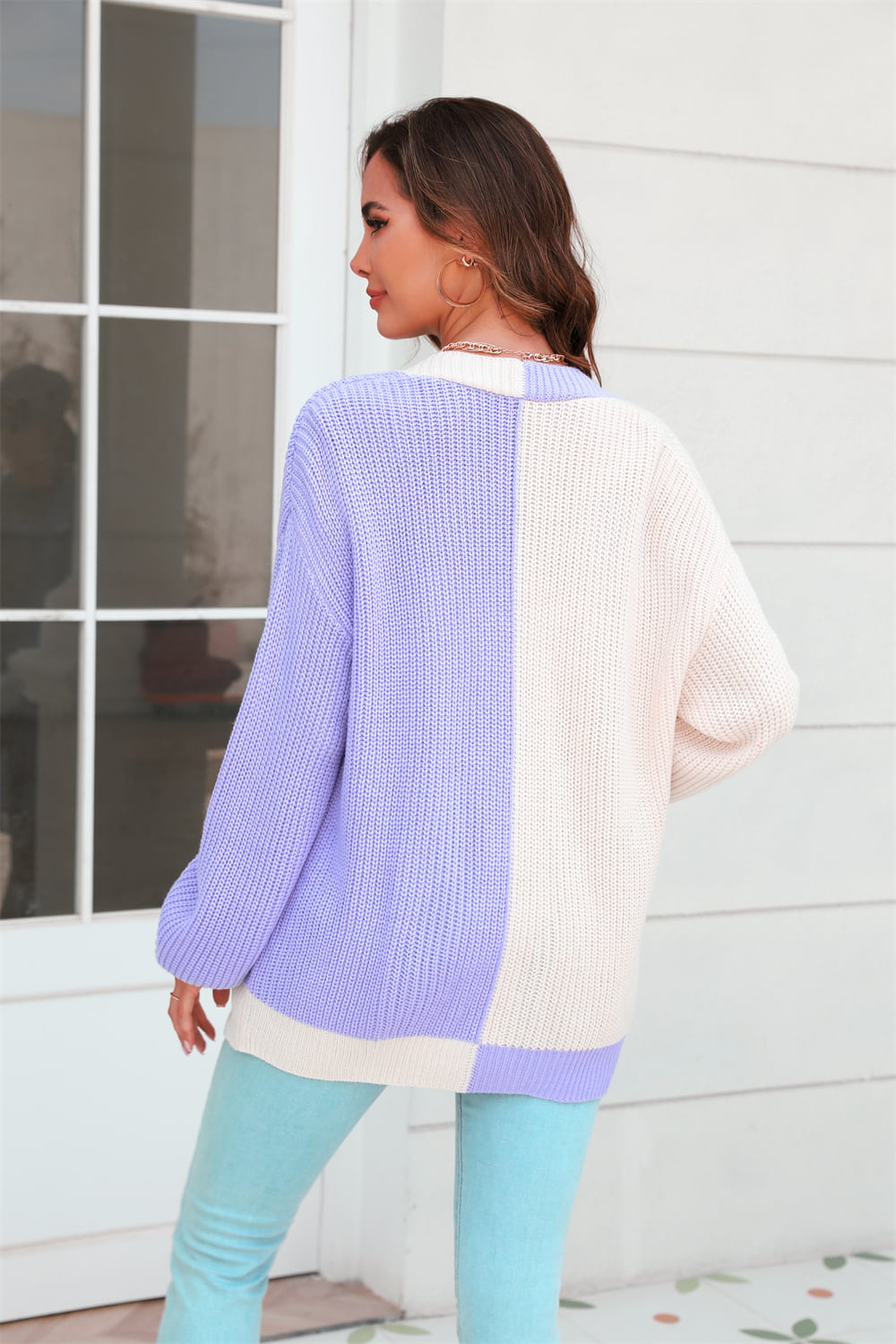 Colorblock knit cardigan in lavender and cream acrylic with contrast trim.