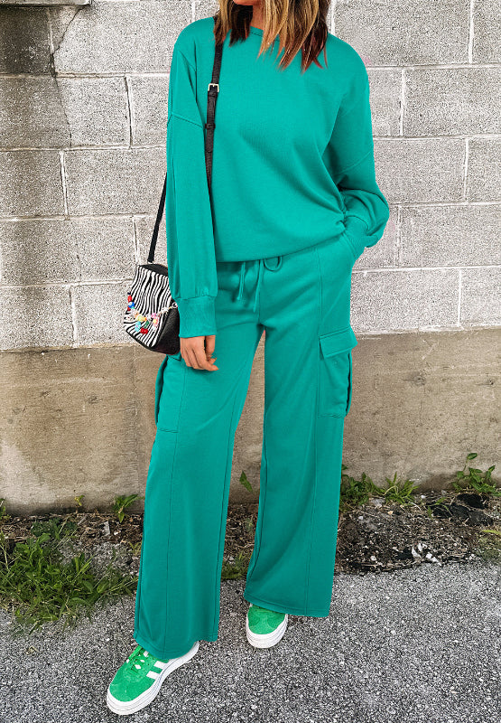 Turquoise cargo pocket lounge set with crewneck sweatshirt and wide leg pants.