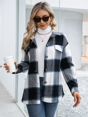 Black plaid belted overshirt with patch pockets and button-down front.