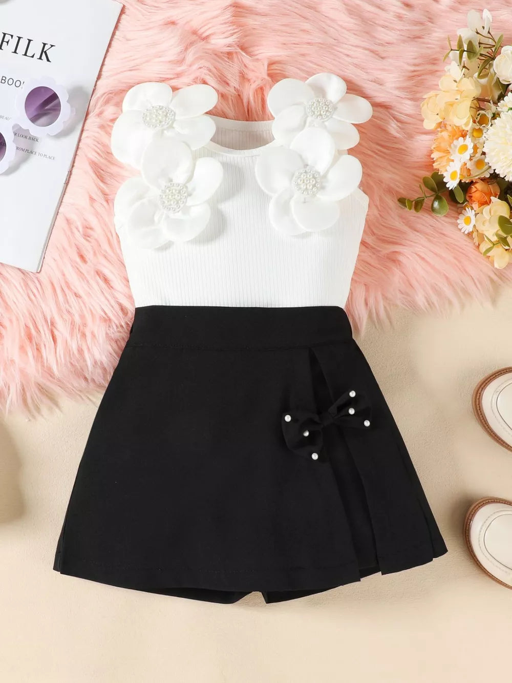 Baby girl floral applique top and bow skort set in black with white ribbed top.