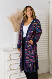 Textured multicolor bouclé maxi cardigan with fringe hem and navy trim.
