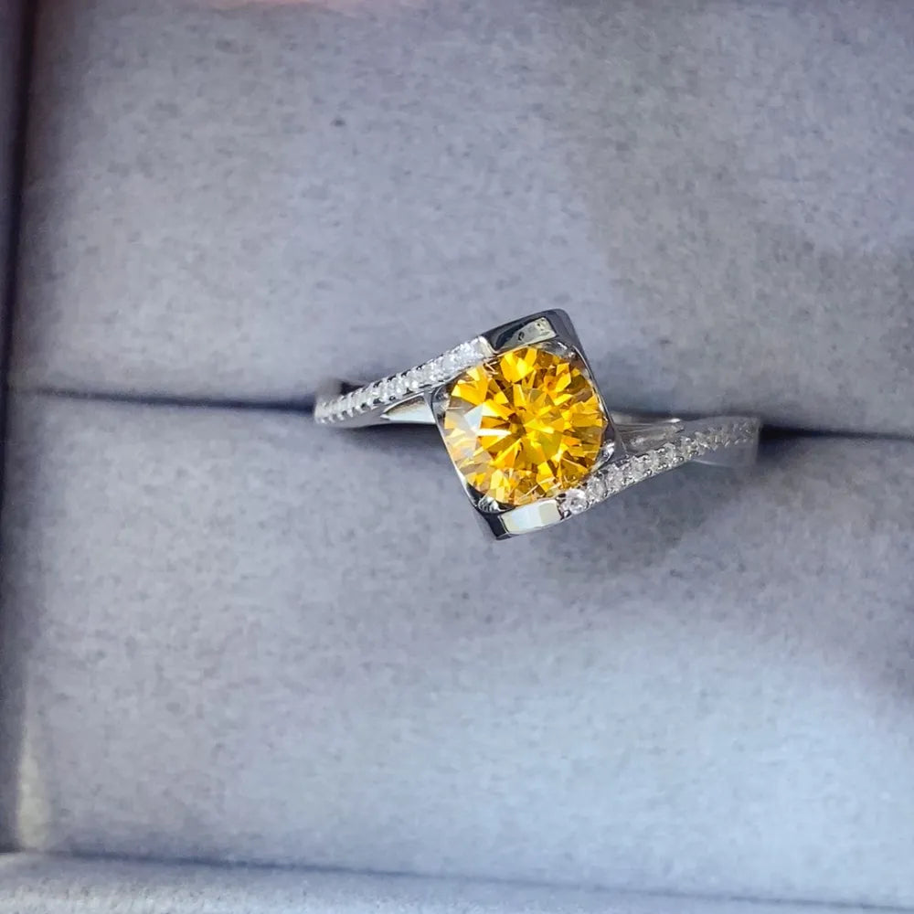 Silver twist ring with radiant yellow moissanite and diamond accents