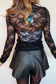 Black sheer floral lace long sleeve fitted shirt with ruched detail.