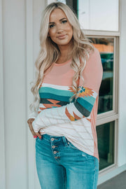 Pink crewneck shirt with Aztec print sleeves and striped hem