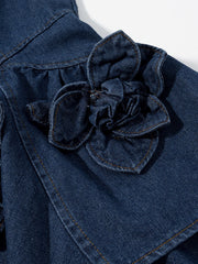 Denim mini dress with floral applique detail and ruffled accents.
