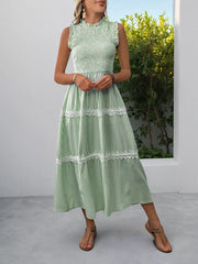 Green striped midi dress with smocked bodice and lace trim details