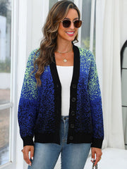 Speckled gradient knit cardigan in navy with button front and black trim.