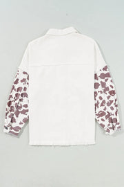 White denim shacket with cow print sleeves and frayed edges