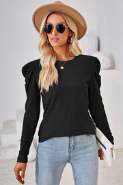 Black textured crew neck top with puff sleeves and diamond pattern