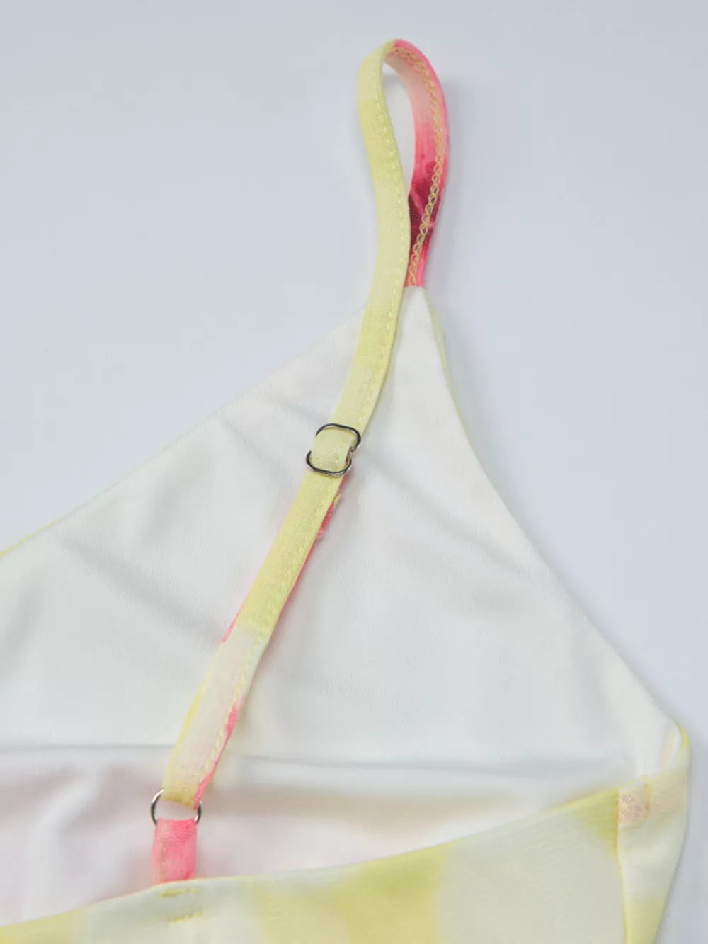 Floral asymmetrical mini dress with ruffled hem, yellow and pink tie-dye print, cotton.