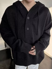 Black knit hooded sweater with button detail and drawstring neckline.