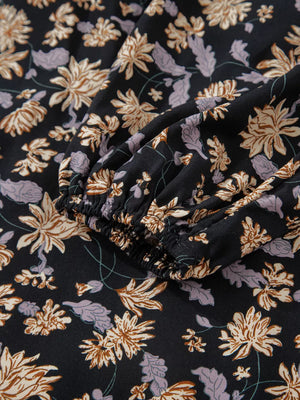Floral babydoll dress with bubble sleeves and a dark floral print.