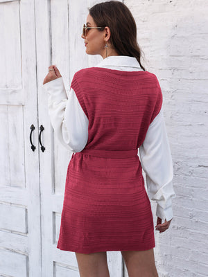 Deep Red knit vest dress with tie waist and slit, styled over a white shirt.