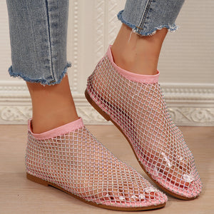 Pink mesh ankle boots with rhinestones and a round toe.