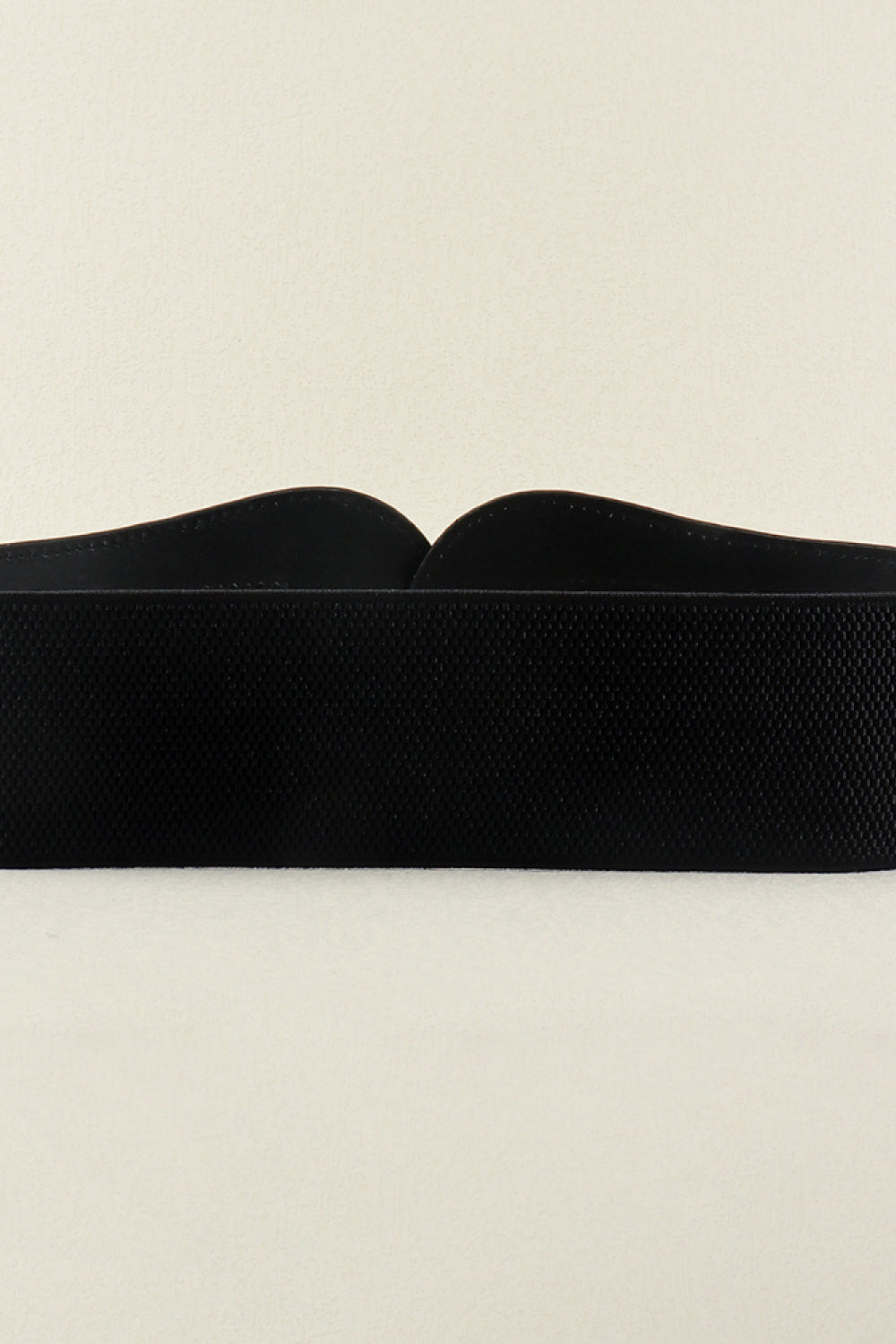 Black elasticated corset belt with textured fabric and sculpted buckle detail