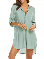 Light Green oversized collared shirt with buttoned front and rolled sleeves.