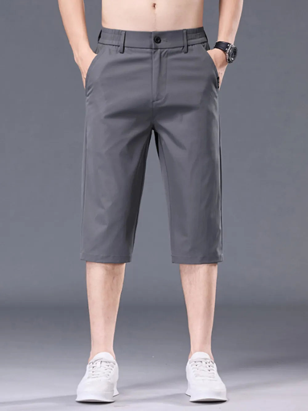 Men's grey chino shorts with pockets and belt loops.