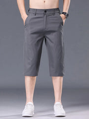 Men's grey chino shorts with pockets and belt loops.