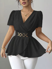 Black surplice blouse with short puff sleeves, belted waist with gold chain detail, and peplum hem.