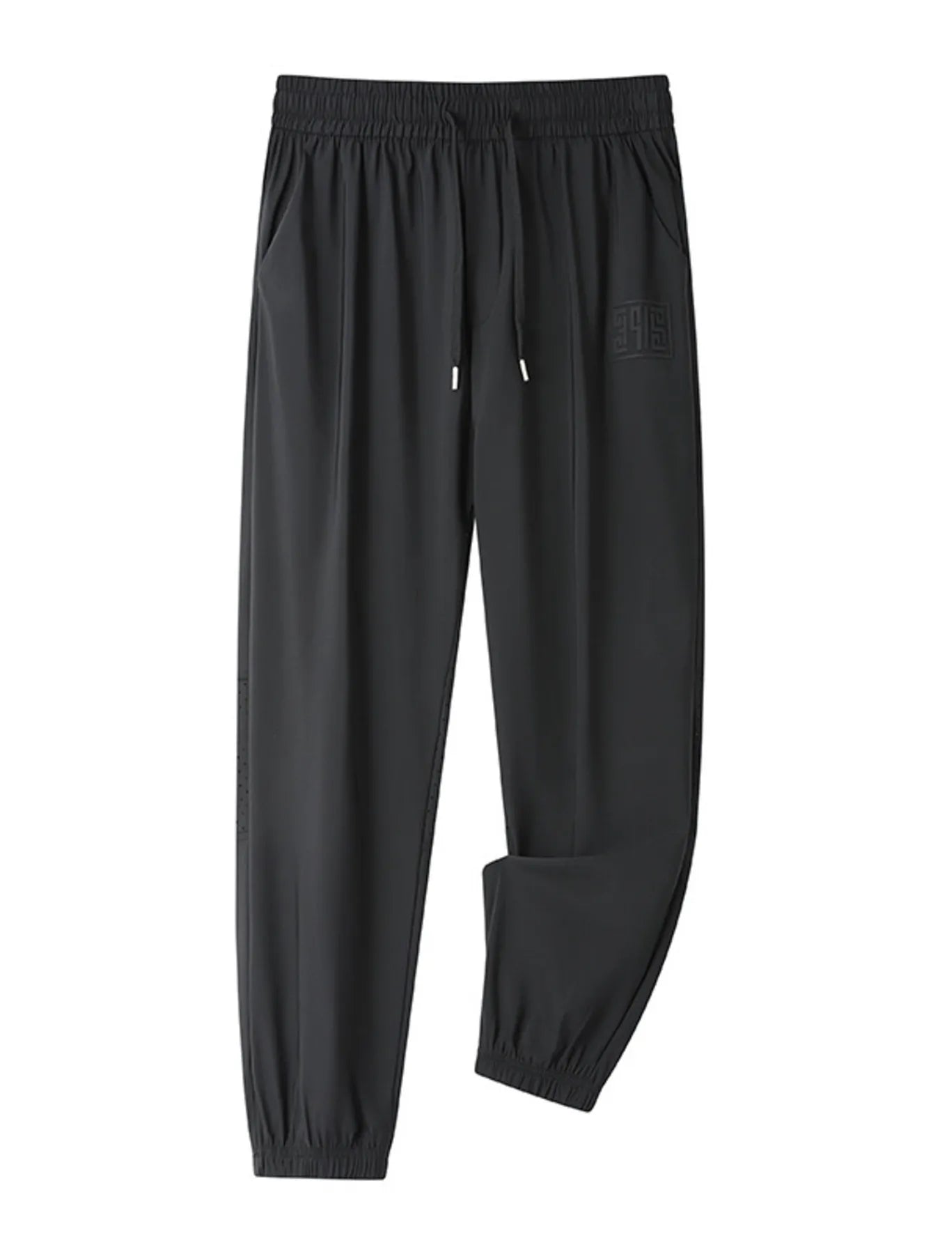 Black drawstring joggers with elastic cuffs and a subtle embossed logo detail.
