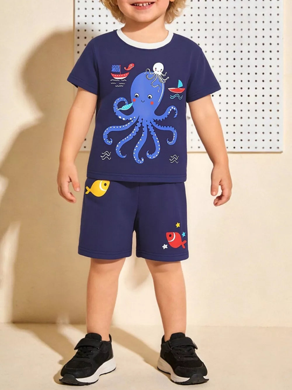 Navy cotton kids' octopus graphic t-shirt and shorts set with fish accents.