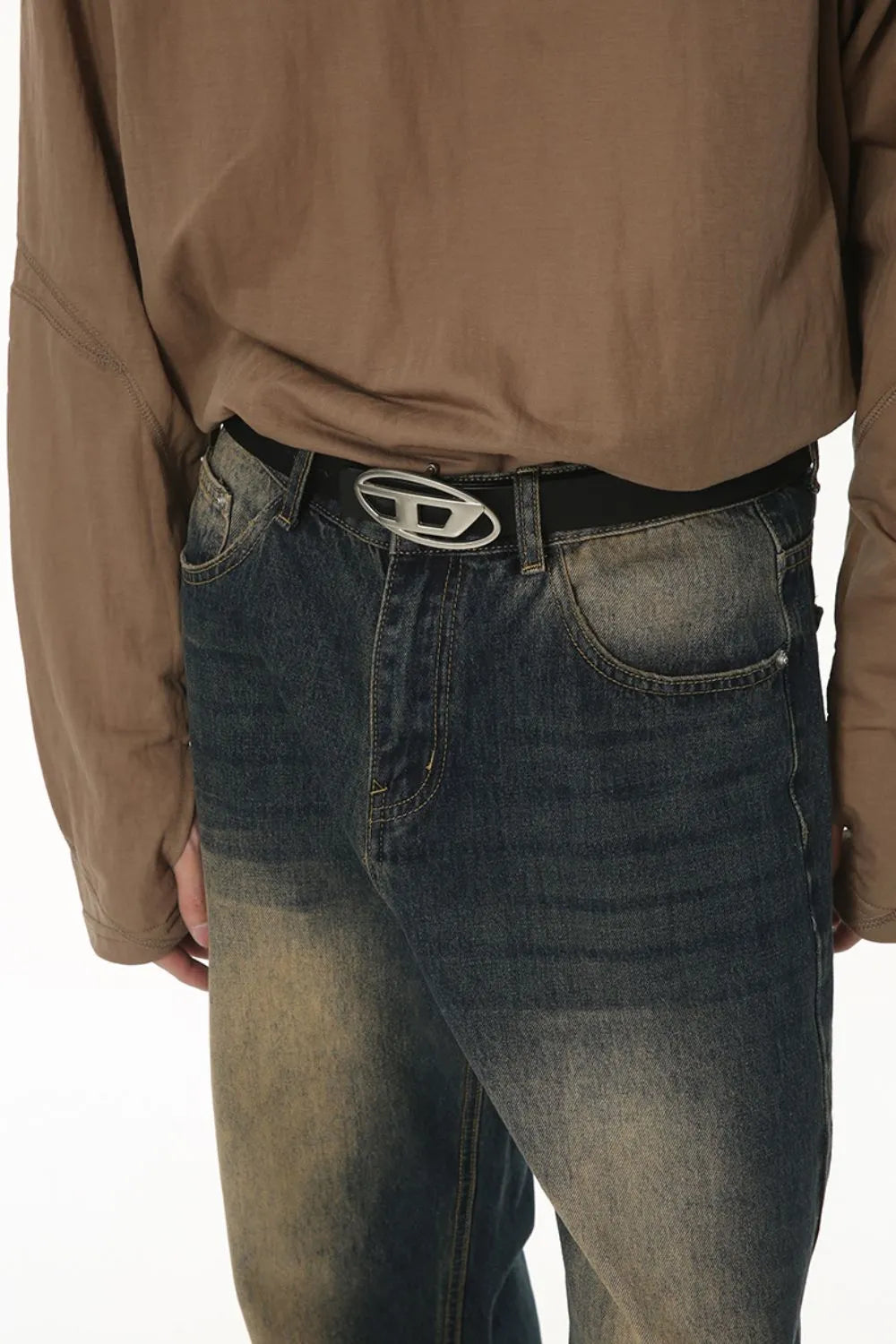 Faded wash baggy denim trousers in dark blue with a distressed look.