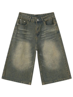 Wide-leg denim culotte shorts in a distressed dark gray wash with a buttoned fly and classic five-pocket styling.