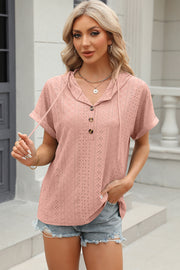 Blush pink perforated henley hooded tee with short sleeves and button detail