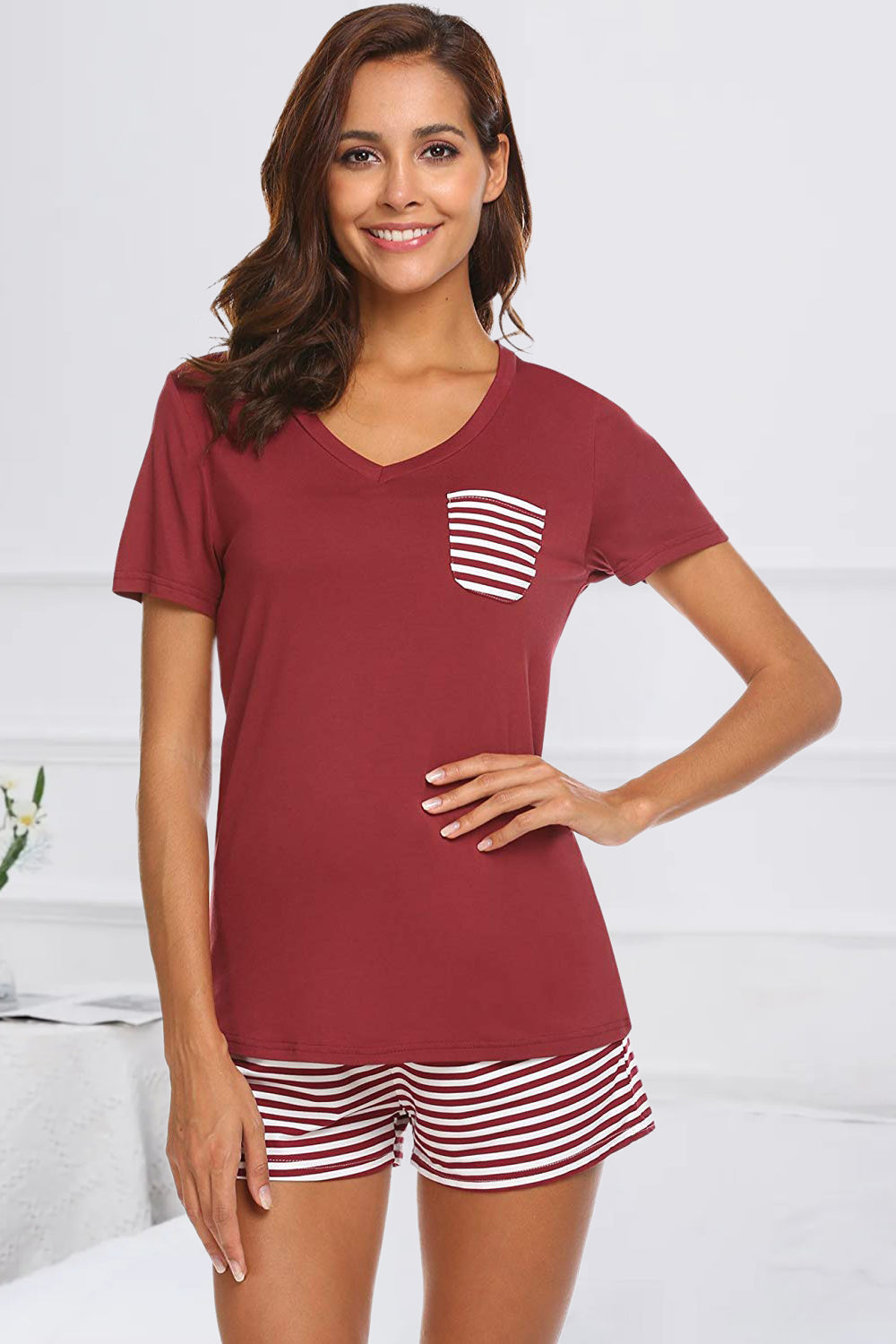 Burgundy V-neck lounge set with striped pocket and matching shorts.