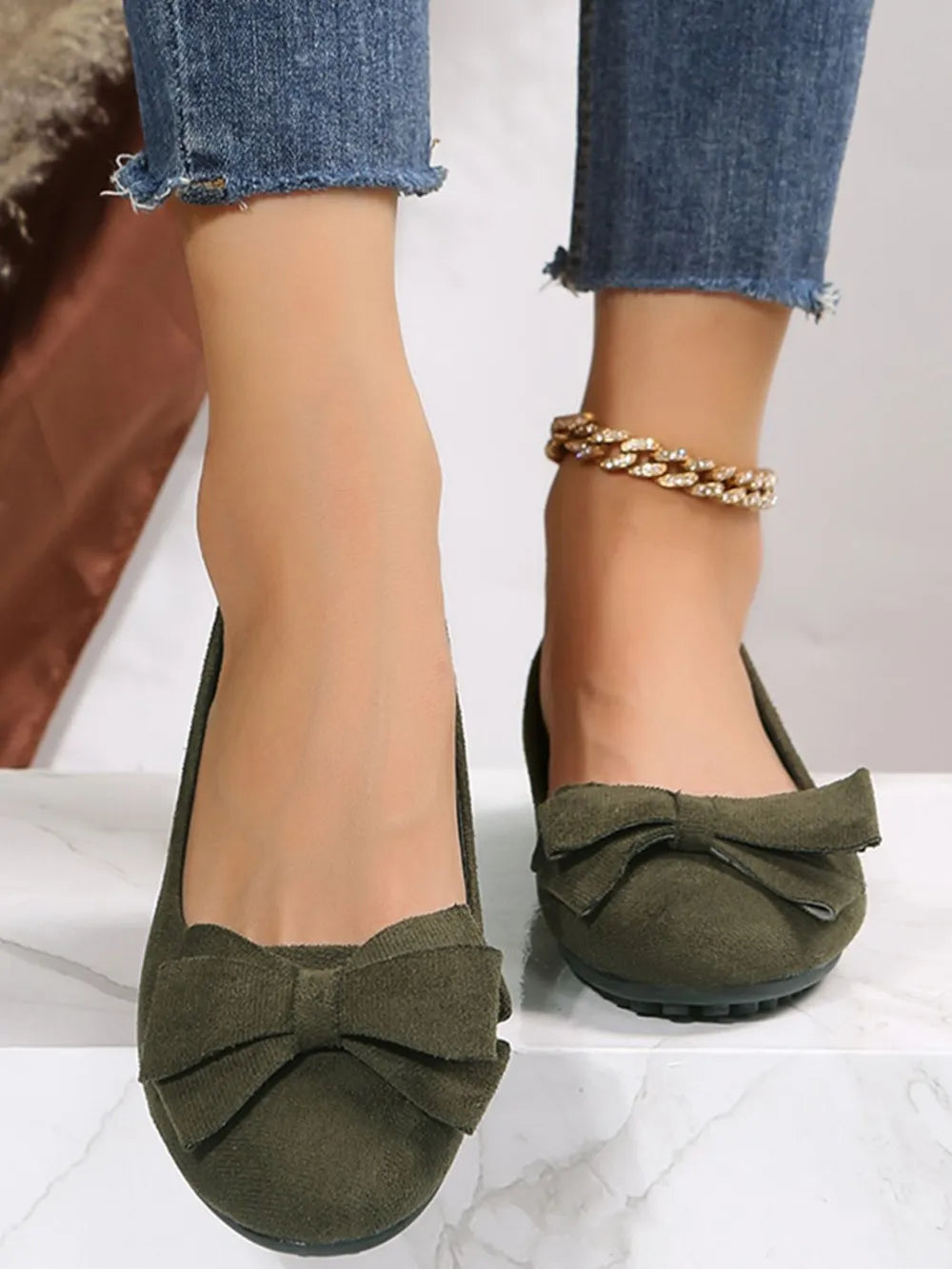 Moss suede pointed-toe flats with bow embellishment