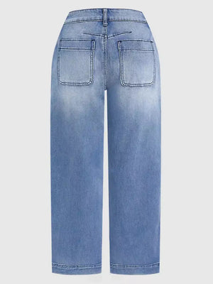 Relaxed high-waisted denim maternity jeans in light blue wash with cuffed hem and back pockets.
