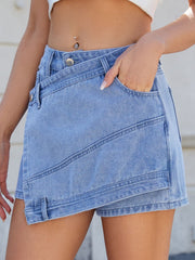 Light blue denim skort with wrap-effect front and angled seams.