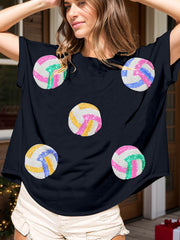 Navy t-shirt with sequin volleyball graphics in pink, blue, yellow, and green.