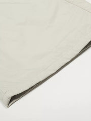 Men's light gray wide-leg sweatpants detail showing crinkled fabric and stitching.
