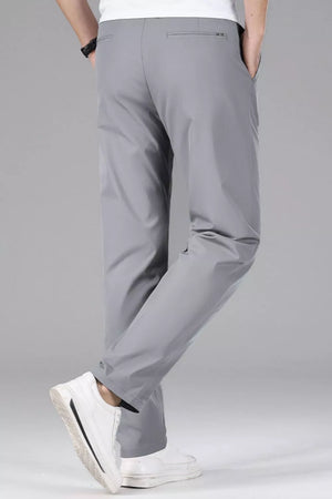 Men's gray slim-fit stretch dress pants with a clean, modern cut.
