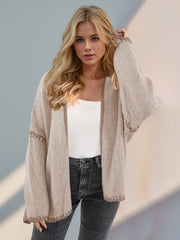 Oversized knit cardigan in tan with contrast stitch detail on sleeves and hem