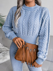 Light blue cable knit cropped mock neck sweater with braided details.