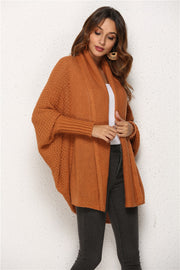 Textured cocoon knit cardigan in caramel with batwing sleeves and shawl collar.