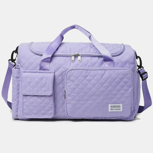Lavender quilted duffel bag with multiple pockets and olive accents