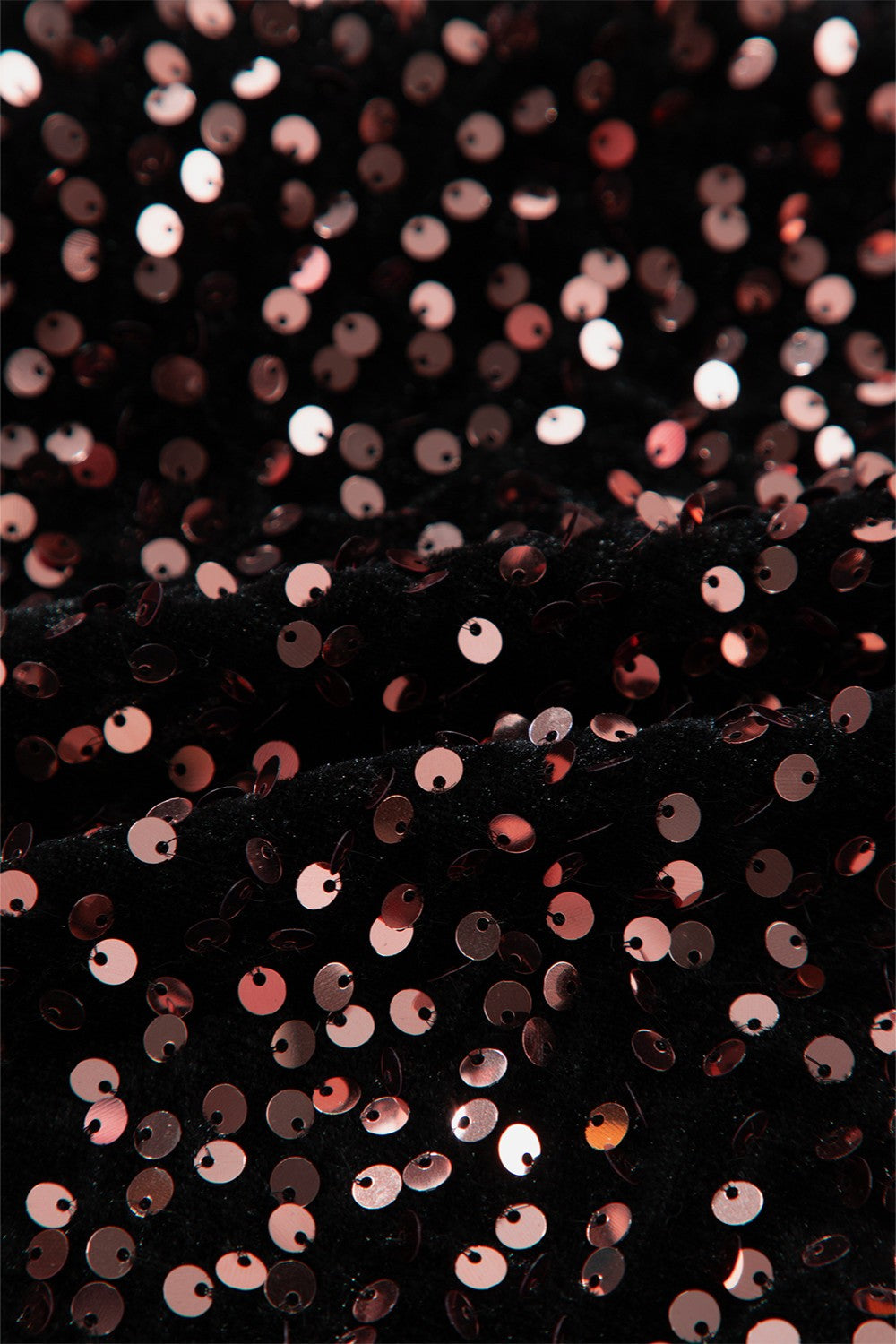 Black sequin backless blouse with rose gold sequins on textured fabric