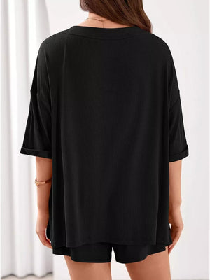 Black ribbed V-neck lounge set with cuffed short sleeves and matching shorts.