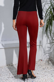 Crimson flare leggings with a sculpted fit, shown from the back.