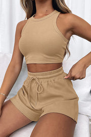 Tan ribbed knit crop top and drawstring shorts set with a racerback neckline.