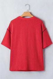 Red ribbed crew neck t-shirt with short sleeves and contrasting stitching detail.