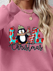 Blush Pink sweatshirt with festive penguin graphic and Christmas text.