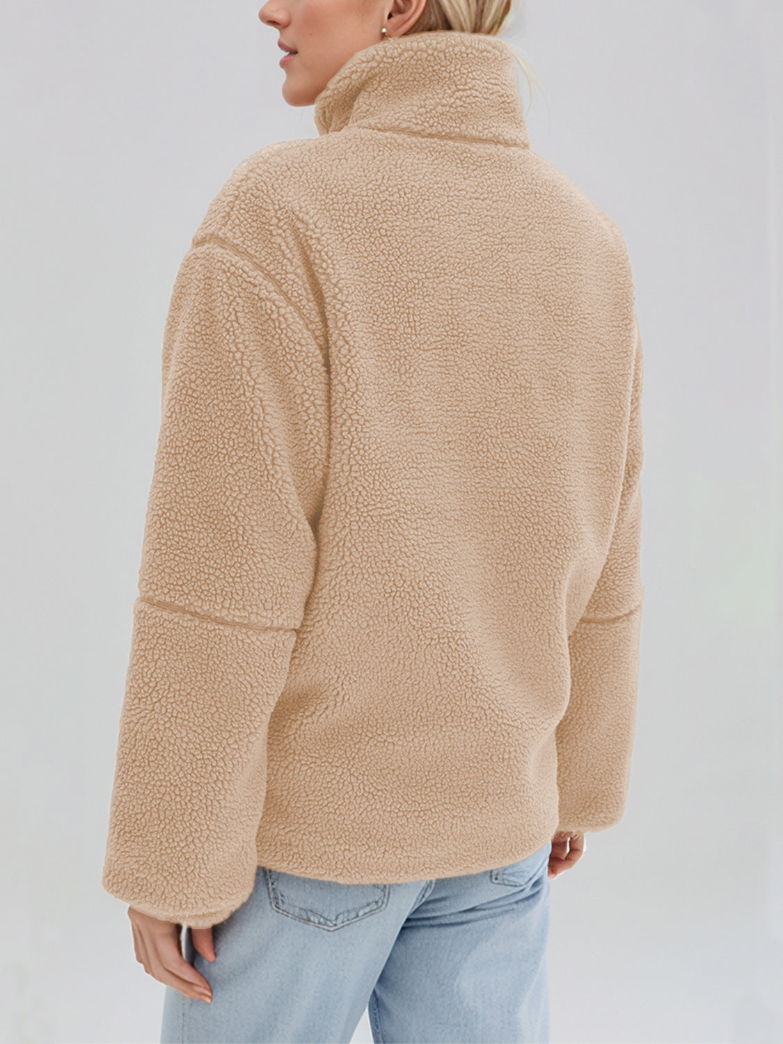 Tan sherpa stand-collar jacket with a textured fleece finish and casual fit.