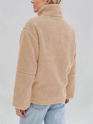 Tan sherpa stand-collar jacket with a textured fleece finish and casual fit.
