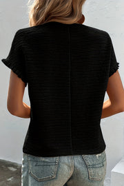 Black textured ribbed cap sleeve blouse with ruffled cuffs.
