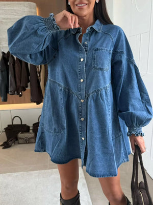 Buttoned denim mini dress with pockets, heart buttons, and smocked cuffs.